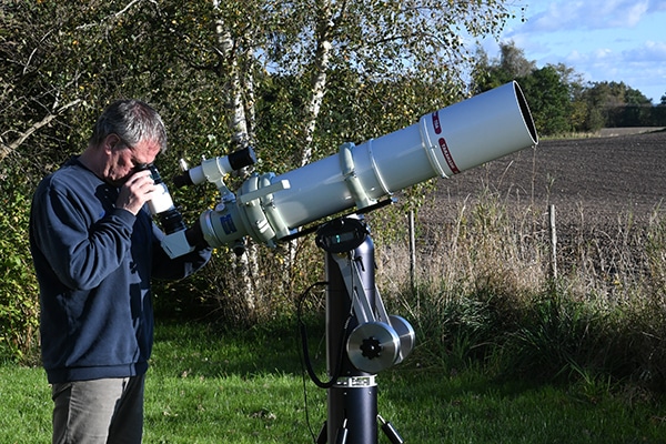 Niels Foldager, owner of a Panther Telescope Mount looking through his telescope