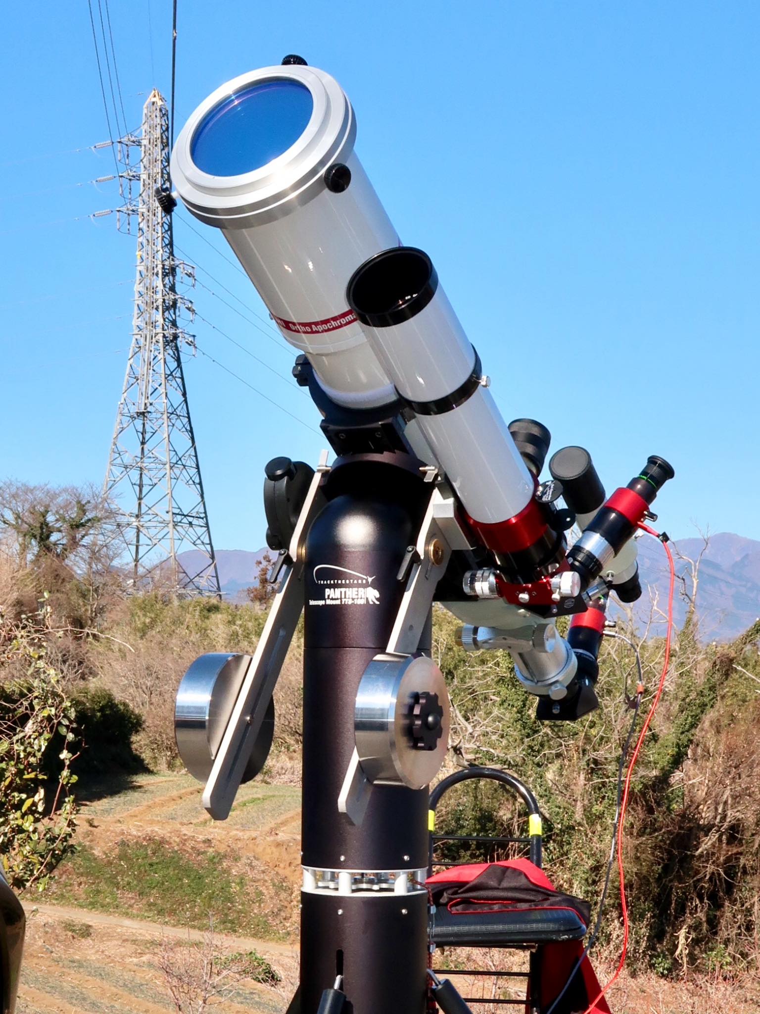 A Takahashi TOA-130 and a Lunt 80mm mounted on a TTS-160 panther telescope mount